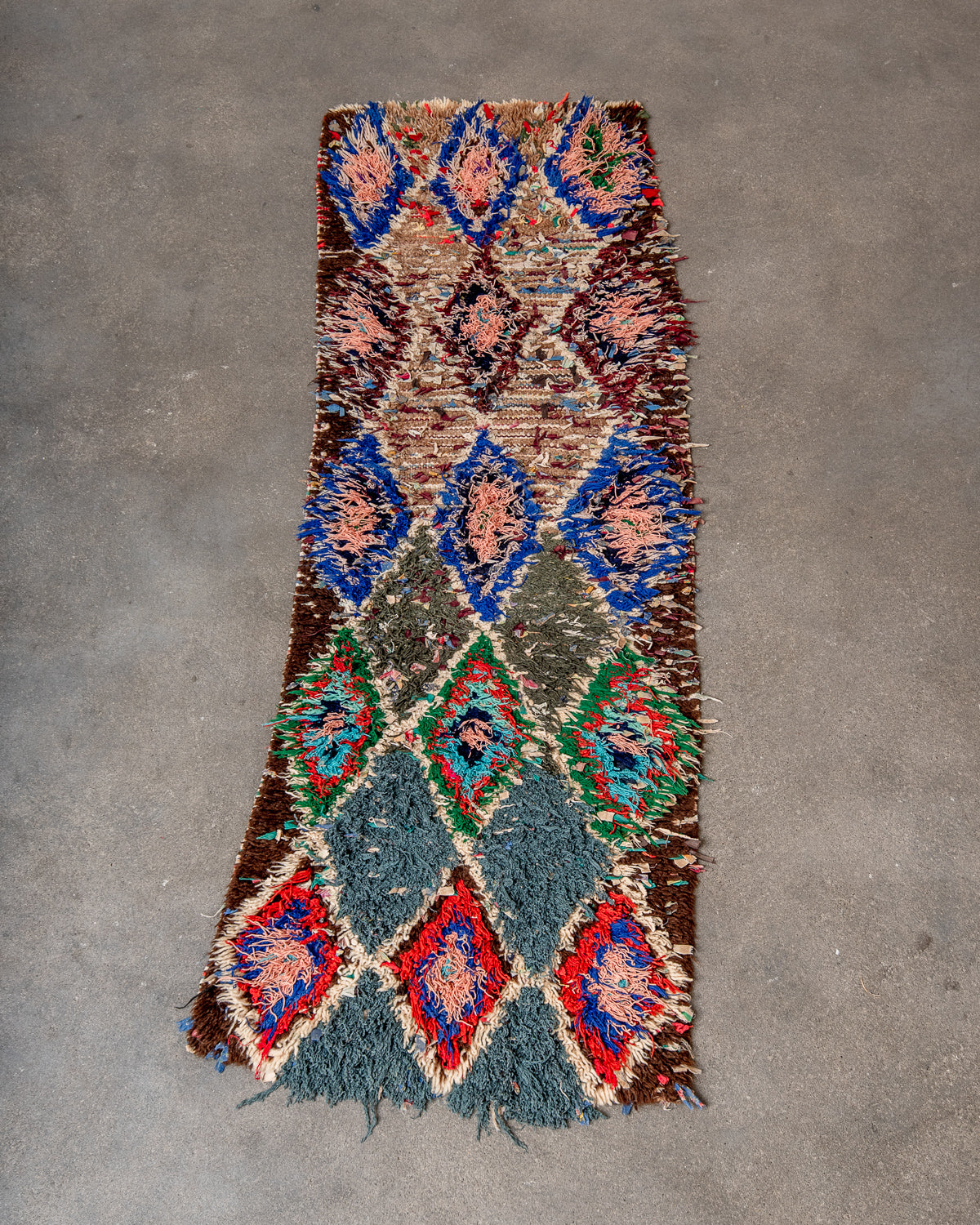 Modern designer vintage handcrafted Berber rug from Morocco. Boucherouite runner rug with beautiful colors and patterns.